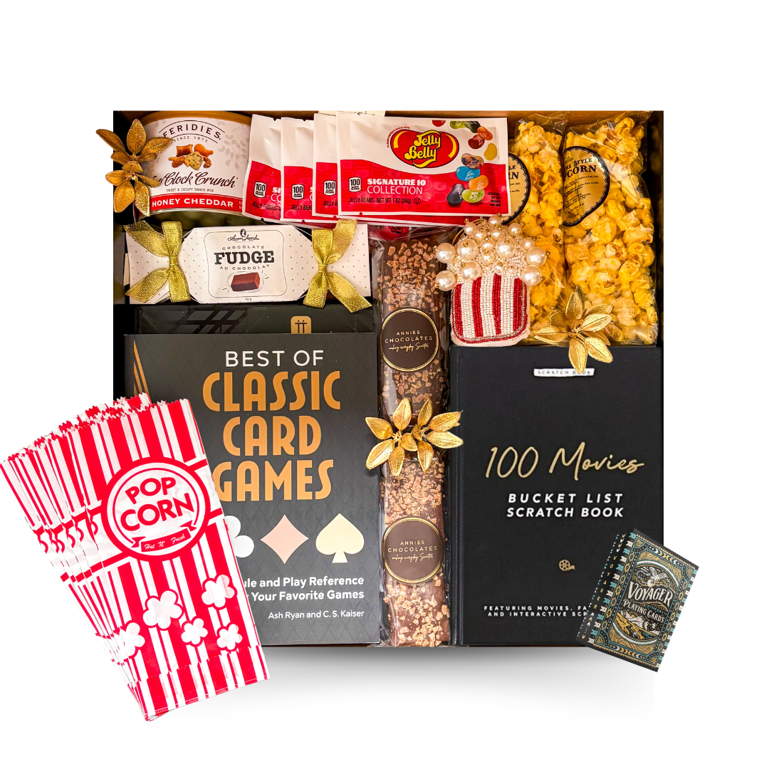 The Perfect Night In movie gift box featuring 100 Movies Bucket List scratch book, gourmet popcorn, chocolates, fudge, candy, movie snacks and festive accents.