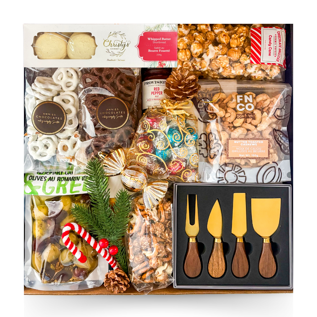 The Season's Best gourmet holiday gift box featuring artisan chocolates, chocolate pretzels, caramel popcorn, gourmet nuts, olives, festive sweets and gold cheese serving utensils.
