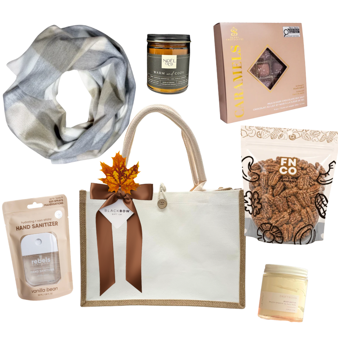 The Cozy Edit gift with reusable canvas bag, stylish scarf, candle, body care, chocolates and maple cinnamon pecans.