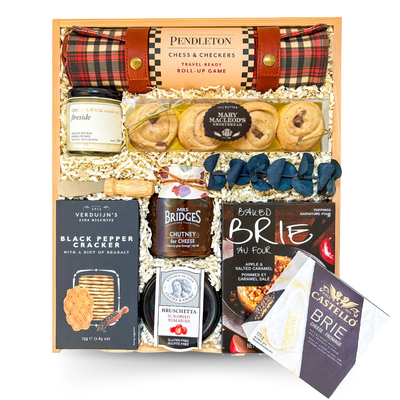Luxury entertainer’s gift box with chess, charcuterie, and coffee table book