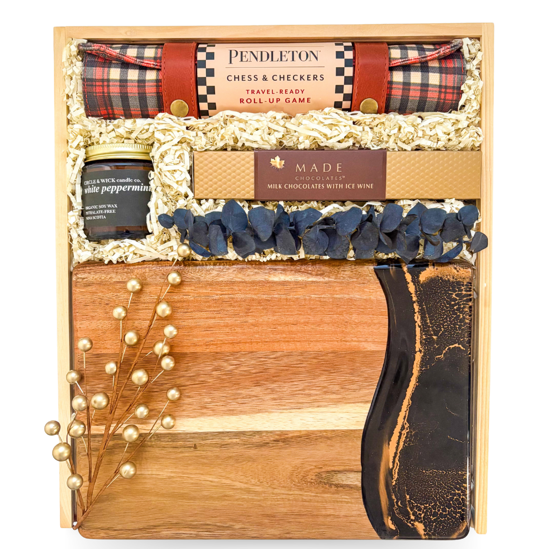 Luxury entertainer’s gift box with chess, charcuterie, and coffee table book