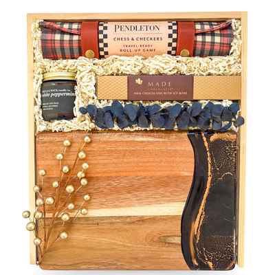 Luxury entertainer’s gift box with chess, charcuterie, and coffee table book