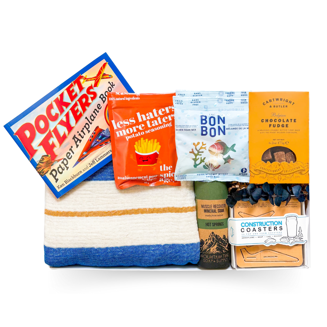 The Good Stuff large gift box with Turkish throw, build-your-own pocket planes, construction coasters, gourmet treats and muscle soak by Black Bow Gift Co.