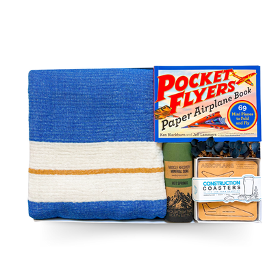 The Good Stuff large gift box with Turkish throw, build-your-own pocket planes, construction coasters, gourmet treats and muscle soak by Black Bow Gift Co.