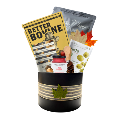 The Good Stuff savoury gift basket box with gourmet snacks, crackers, pepper jelly, cashews, olives and serving accessories.