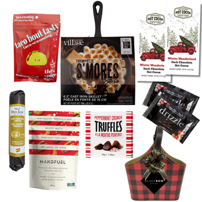 The Great Indoors gourmet gift basket featuring hot chocolate, peppermint truffles, gourmet nuts and savoury snacks in a red and black buffalo plaid keepsake basket.