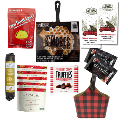 The Great Indoors gourmet gift basket featuring hot chocolate, peppermint truffles, gourmet nuts and savoury snacks in a red and black buffalo plaid keepsake basket.