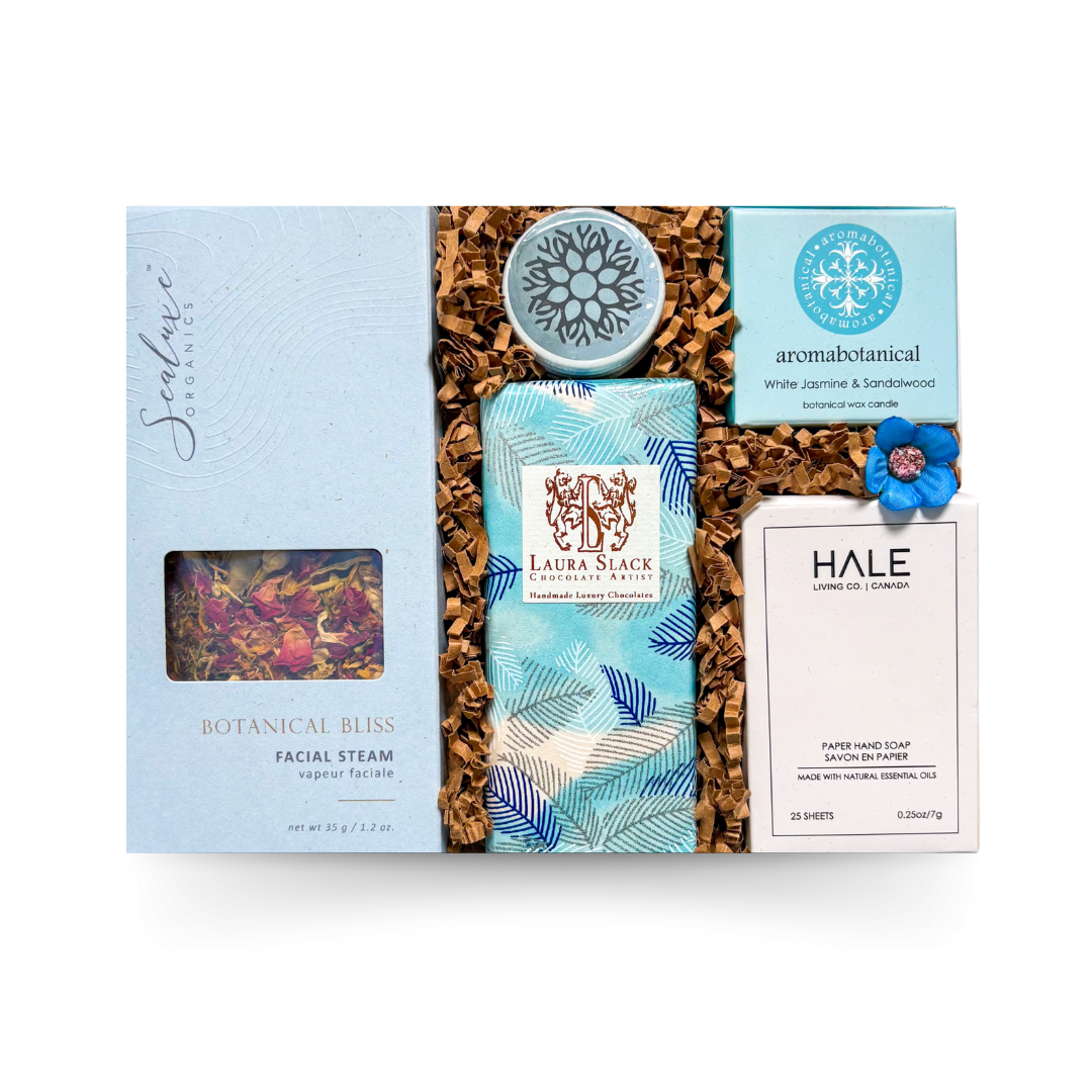The Mini Retreat small spa gift box in signature packaging with botanical facial steamer, artisan chocolate, candle and lip balm by Black Bow Gift Co.
