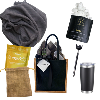 The Reset gender-neutral wellness and recovery gift with self-care and hydration essentials in a black gift tote.