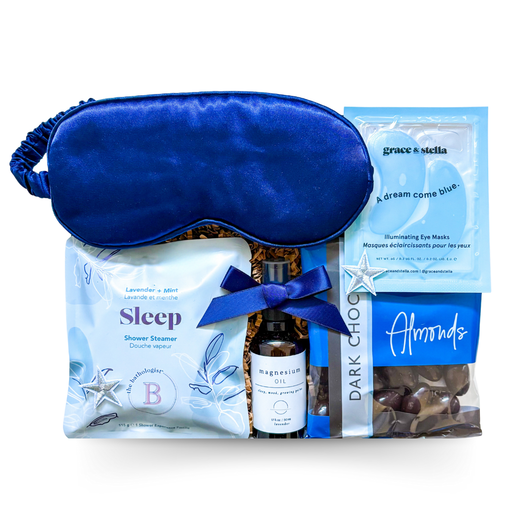 The Sleep Kit Gift Box with star accents, navy satin sleep mask, and wellness essentials styled in soft blue and white for a dreamy, restful theme.