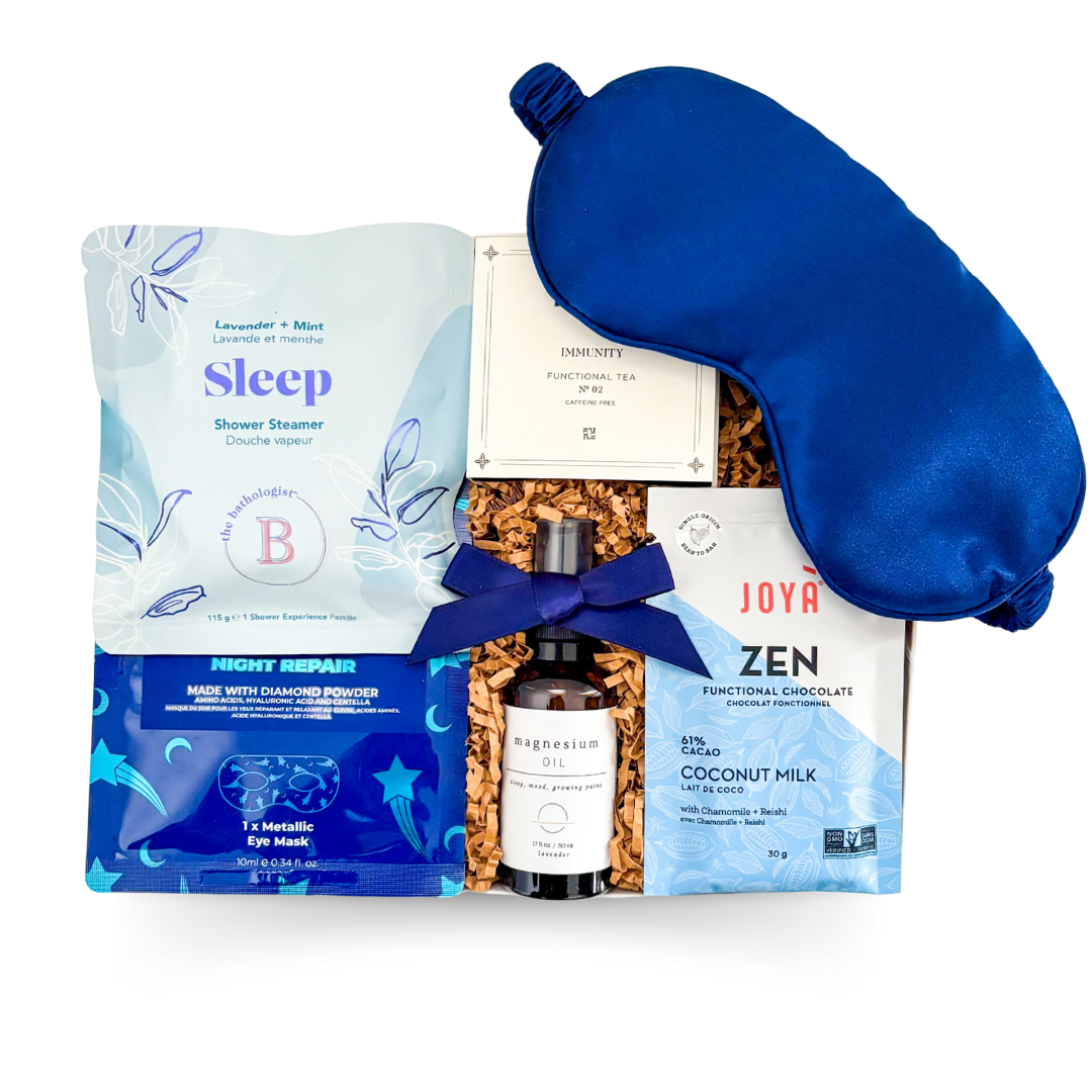 The Sleep Kit gift box with navy and white starry design, luxe sleep accessories, calming tea, and relaxation-inspired treats.
