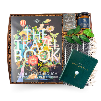 The Travel Collection luxury travel gift with premium world travel book, Theory11 Voyager playing cards, Turkish throw and sea salt candle on wooden serving tray by Black Bow Gift Co.