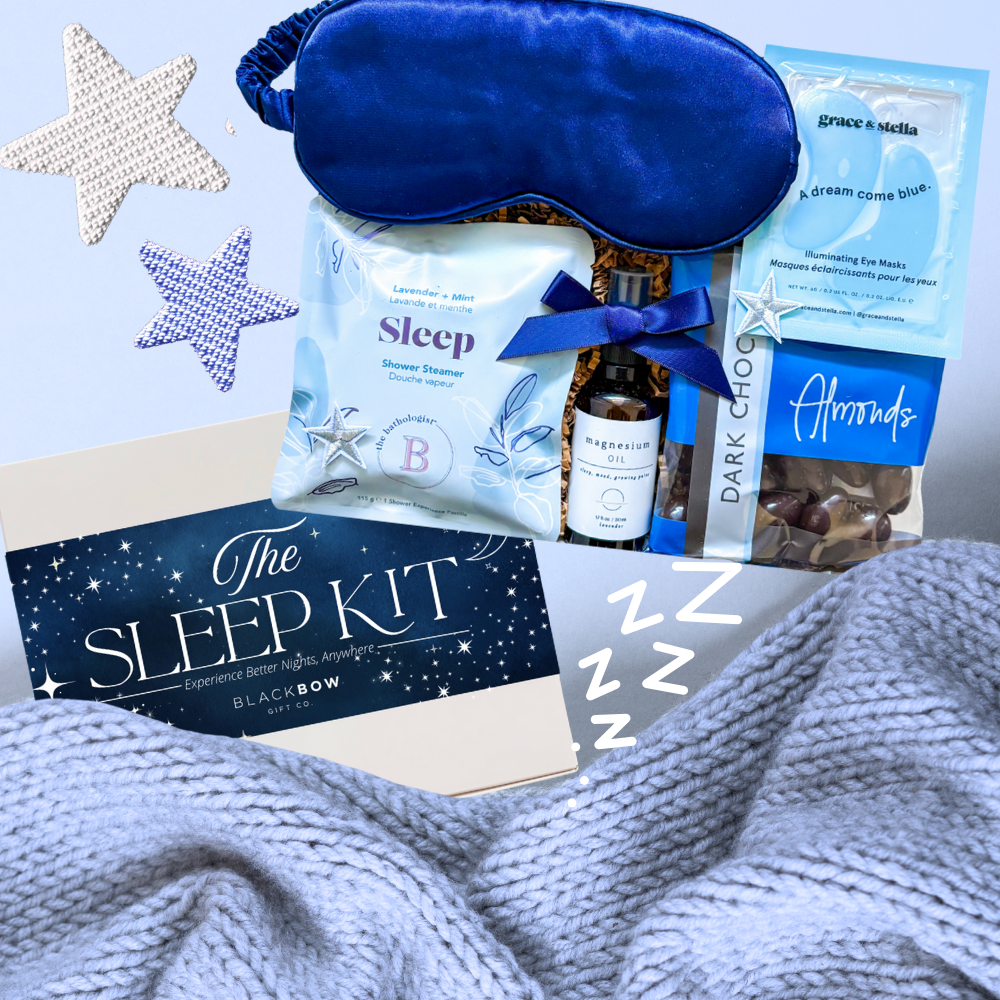 The Sleep Kit Gift Box with star accents, navy satin sleep mask, and wellness essentials styled in soft blue and white for a dreamy, restful theme.
