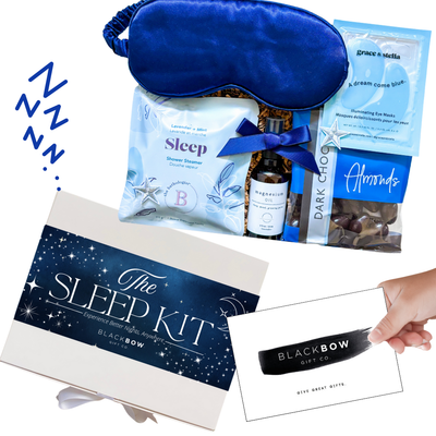 The Sleep Kit Gift Box with star accents, navy satin sleep mask, and wellness essentials styled in soft blue and white for a dreamy, restful theme.