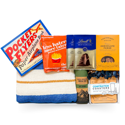 The Good Stuff large gift box with Turkish throw, build-your-own pocket planes, construction coasters, gourmet treats and muscle soak by Black Bow Gift Co.