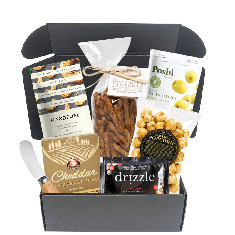 The Grazing Hour gourmet gift box with cheese spread, pretzels, cashews, olives, caramel popcorn, honey and cheese knife

