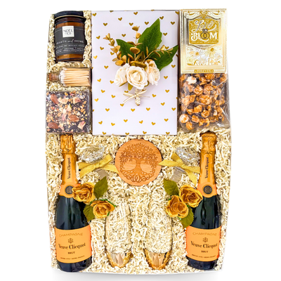 Luxury champagne gift box featuring Veuve Clicquot, champagne flutes, gourmet treats, romantic accents, and XL keepsake presentation by Black Bow Gift Co.