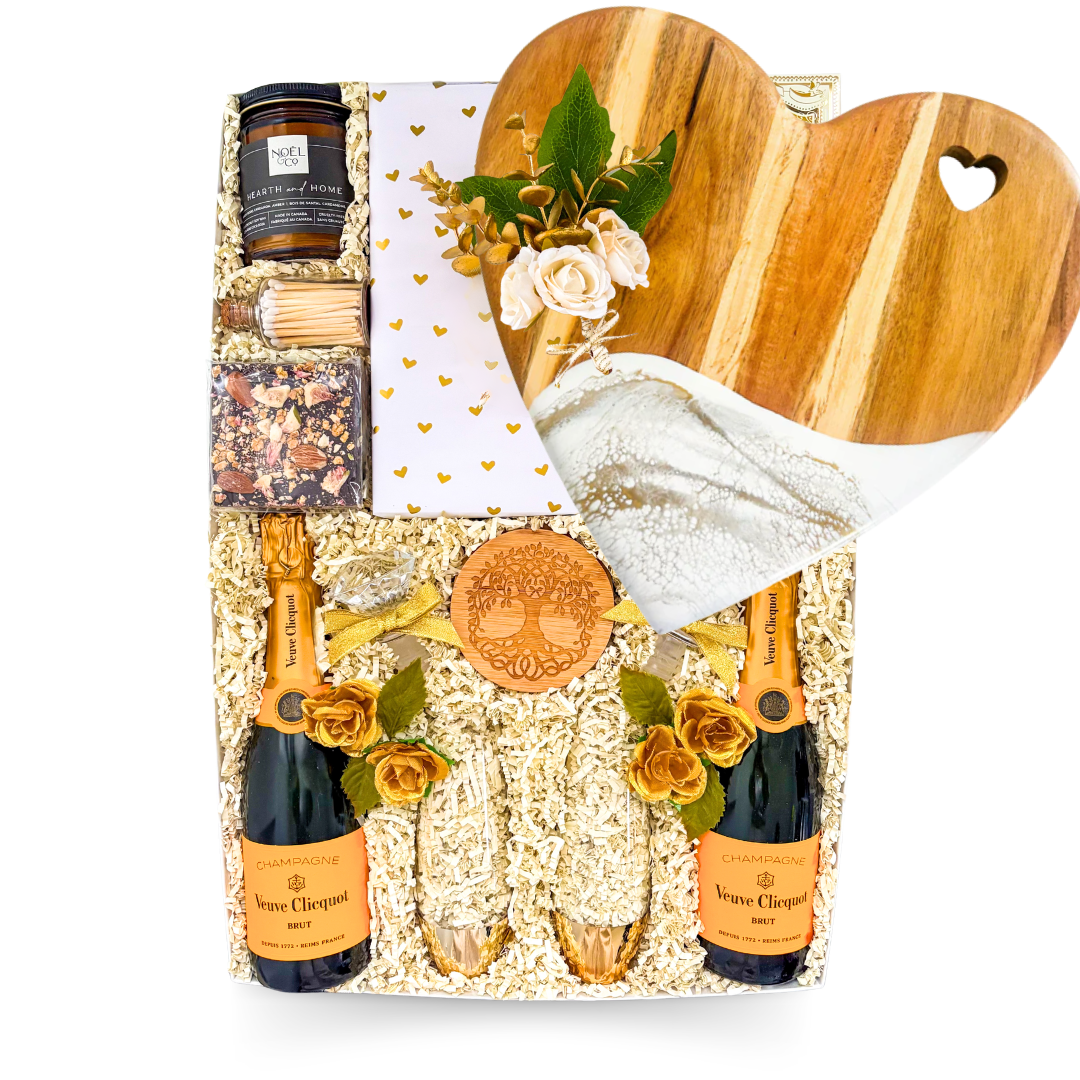 Luxury champagne gift box featuring Veuve Clicquot, champagne flutes, gourmet treats, romantic accents, and XL keepsake presentation by Black Bow Gift Co.