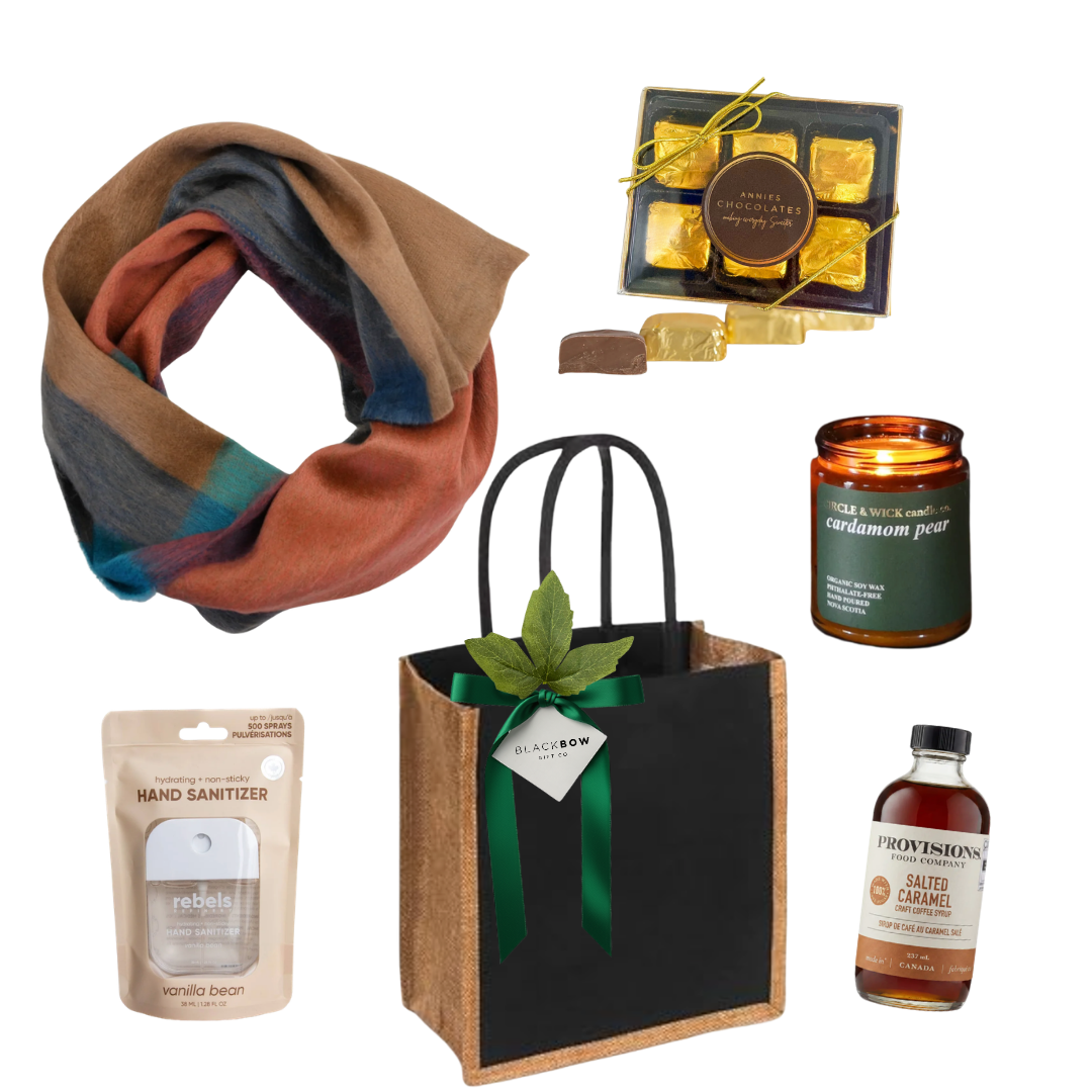 A Warm Gesture gift with colourful scarf, candle, chocolates, salted caramel syrup and reusable tote.
