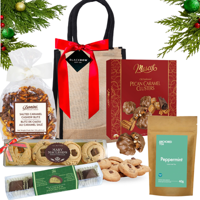 Warm Wishes gourmet gift beautifully arranged in a keepsake jute bag, styled with premium chocolates and elegant festive accents.