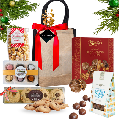 Warm Wishes gourmet gift beautifully arranged in a keepsake jute bag, styled with premium chocolates and elegant festive accents.