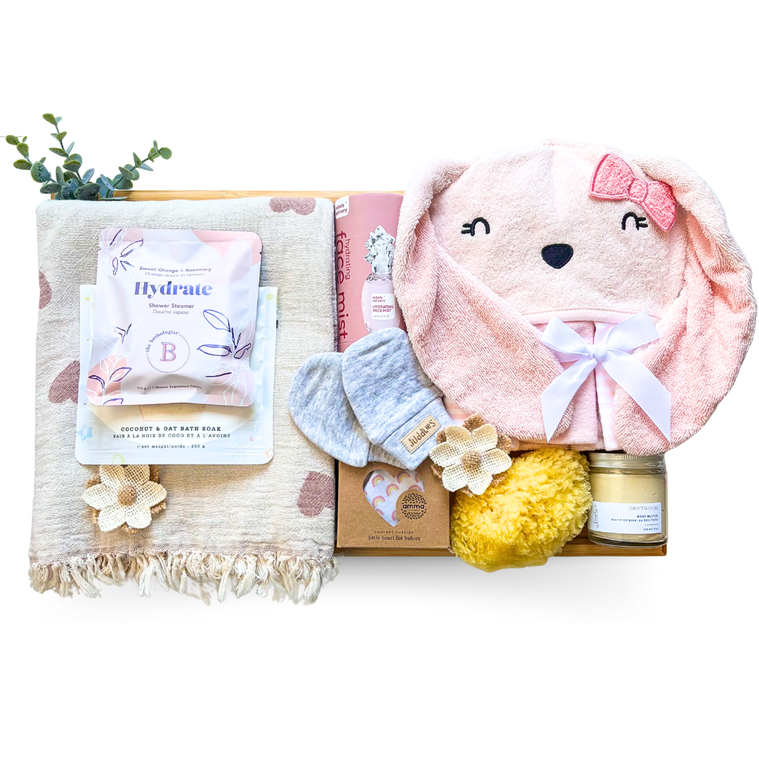 Welcome Little Love luxury baby and mom gift basket on bamboo tray with soft textiles and newborn essentials by Black Bow Gift Co.
