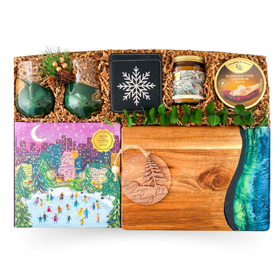 Winter Luxe XL premium holiday gift box with jade and gold glasses, graze board, candle, and snowflake coasters