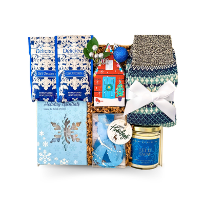 Luxury blue and white holiday gift box with Let It Snow candle, Nordic socks, and festive cocoa by Black Bow Gift Co.