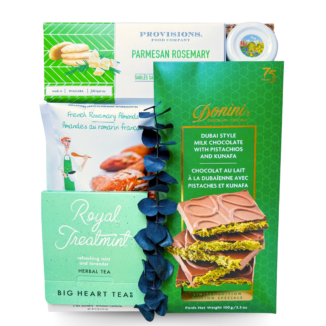 Worldly Delights gourmet gift box styled in green and white, celebrating global-inspired flavors.