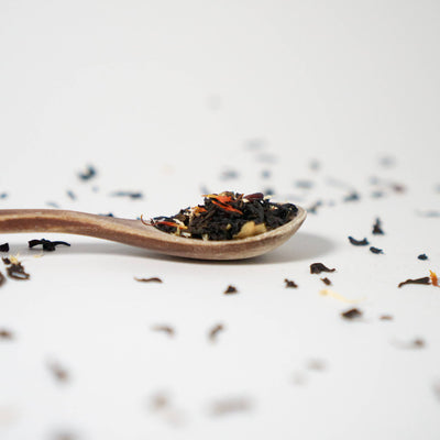 Festive Christmas tea blend in a decorative canister with Ceylon black tea, orange, cinnamon, and clove