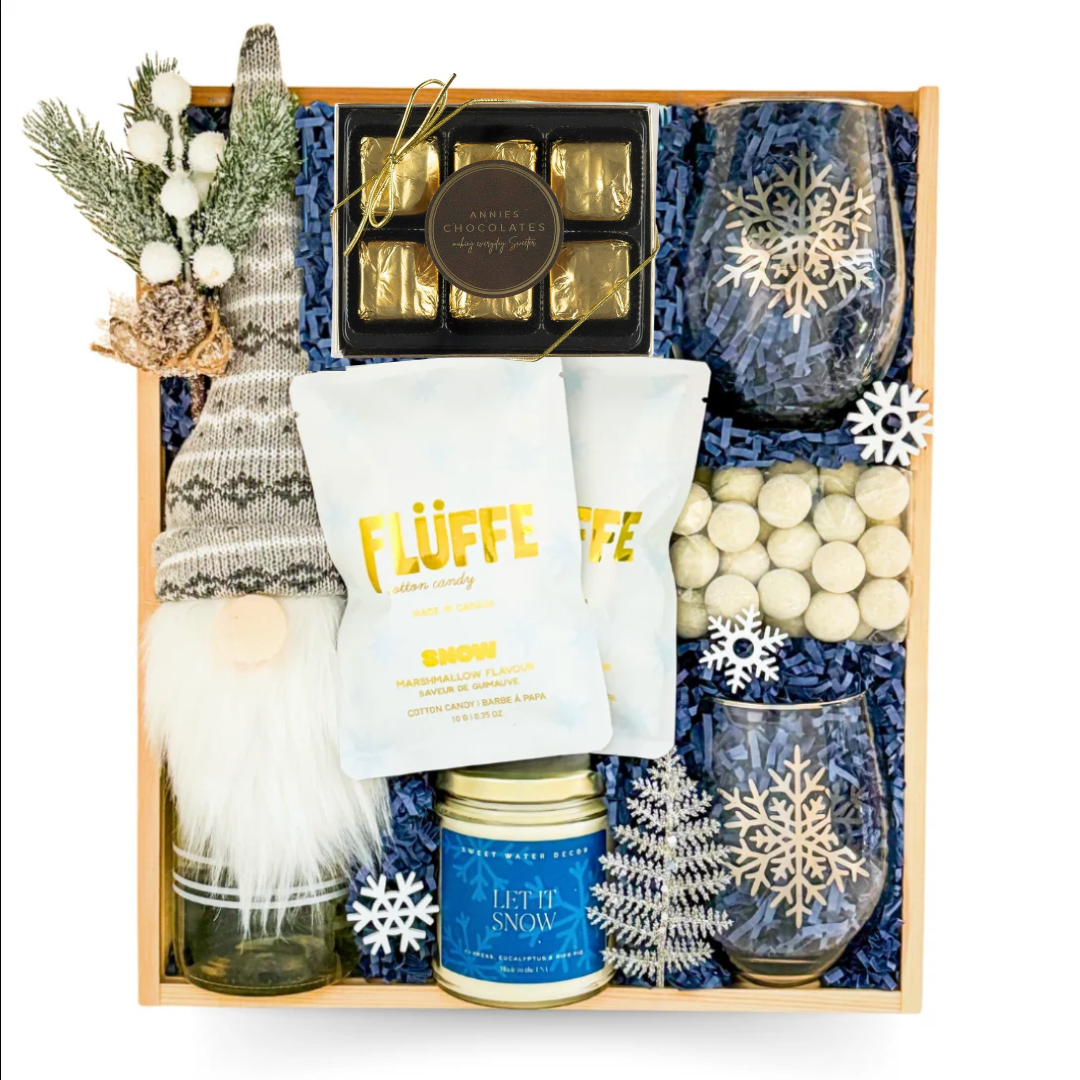 Snow Much Fun winter gift box with blue-and-white snowflake accents arranged in a wooden keepsake box.
